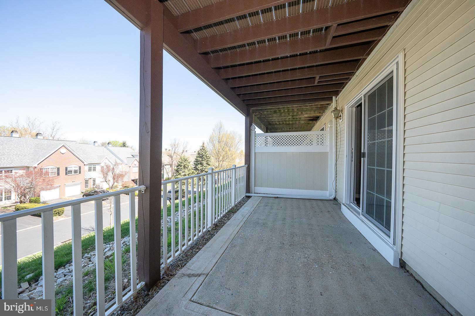 234 Lookout Place Wayne, PA 19087 - Photo 25 of 32 a view of a porch with wooden floor in front of a house