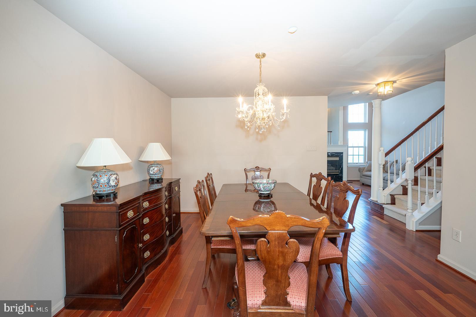 234 Lookout Place Wayne, PA 19087 - Photo 4 of 32 a view of a dining room with furniture a chandelier and wooden floor