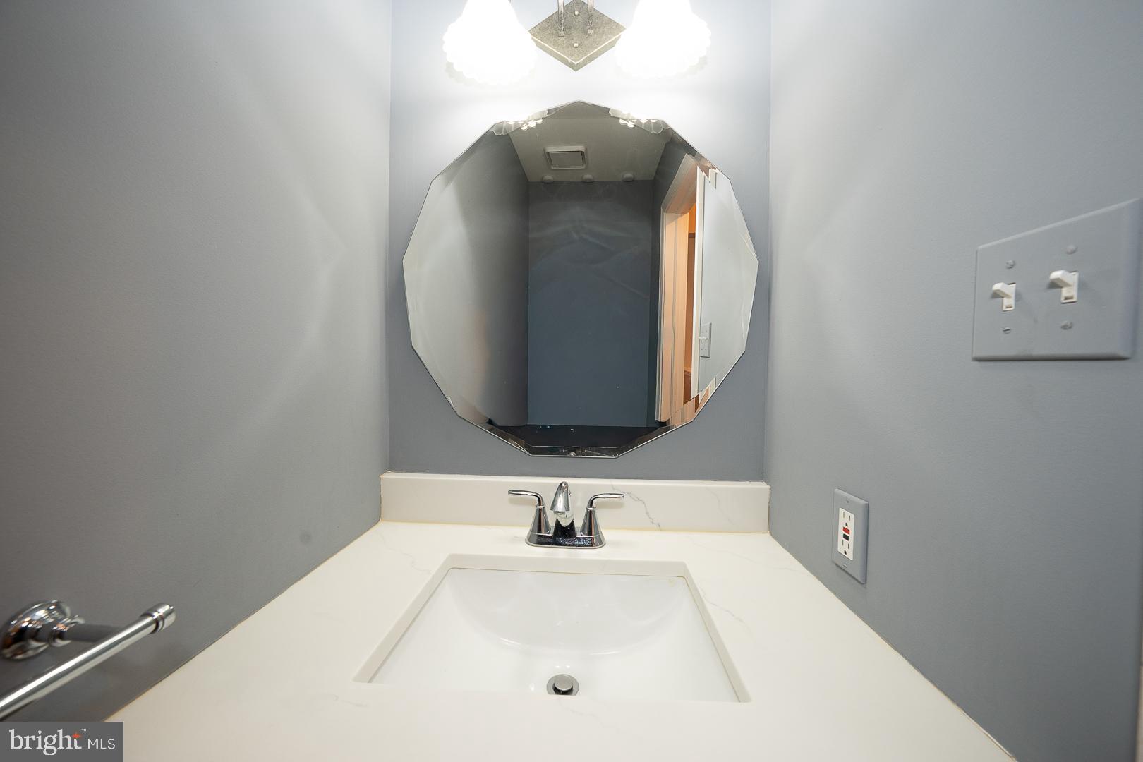 234 Lookout Place Wayne, PA 19087 - Photo 5 of 32 a bathroom with a sink and mirror
