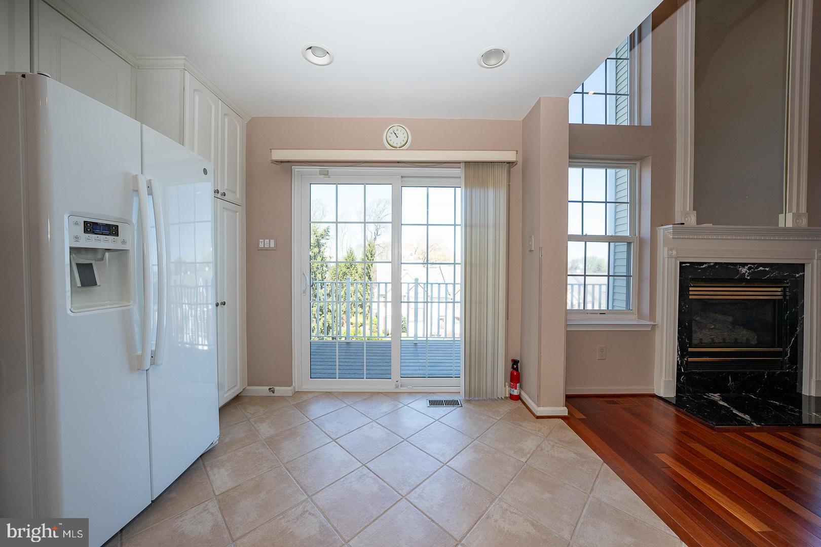 234 Lookout Place Wayne, PA 19087 - Photo 8 of 32 a view of an empty room with a window and fire place