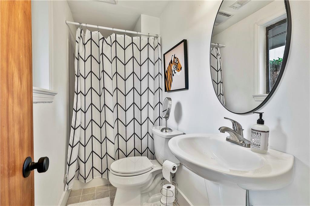 511 East Boyd Road Hogansville, GA 30230 - Photo 13 of 28 a bathroom with a sink and a mirror