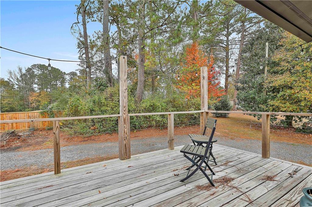 511 East Boyd Road Hogansville, GA 30230 - Photo 17 of 28 a view of a balcony with wooden floor and outdoor seating