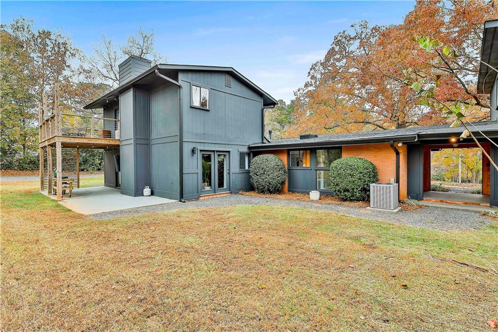 511 East Boyd Road Hogansville, GA 30230 - Photo 20 of 28 a front view of a house with a yard and potted plants