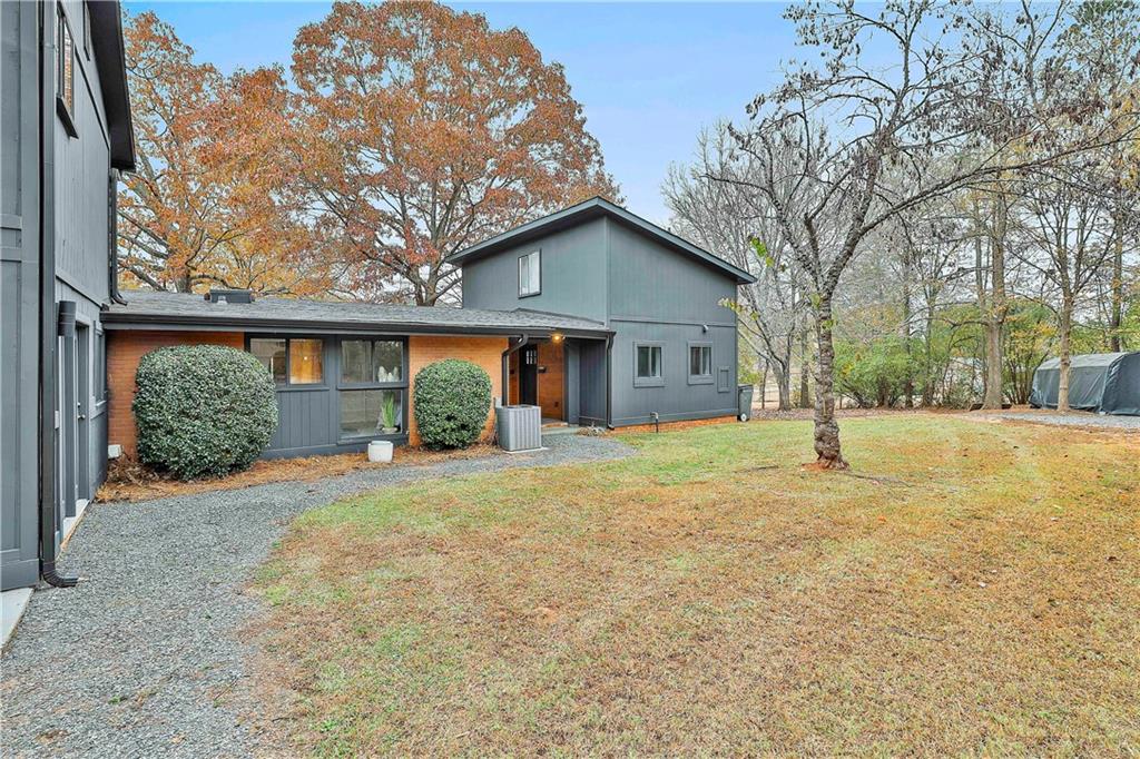511 East Boyd Road Hogansville, GA 30230 - Photo 21 of 28 a view of a house with a yard and garage