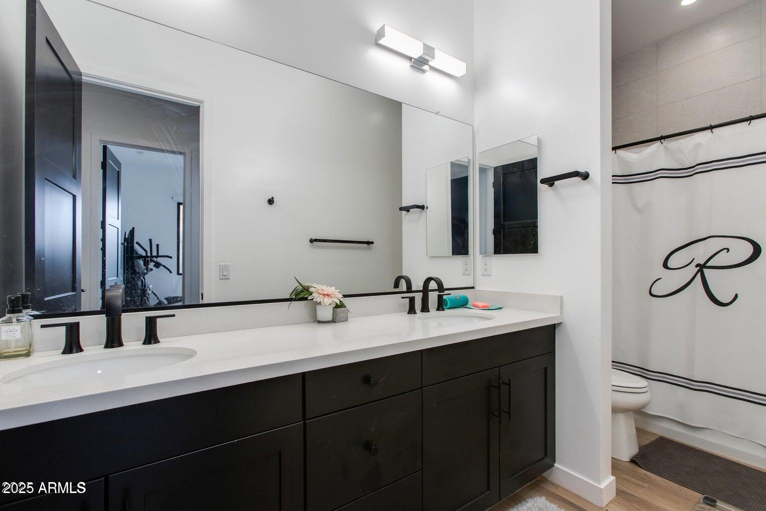 100 West Northern Avenue, Unit 17 Phoenix, AZ 85021 - Photo 16 of 20 a bathroom with a double vanity sink and mirror