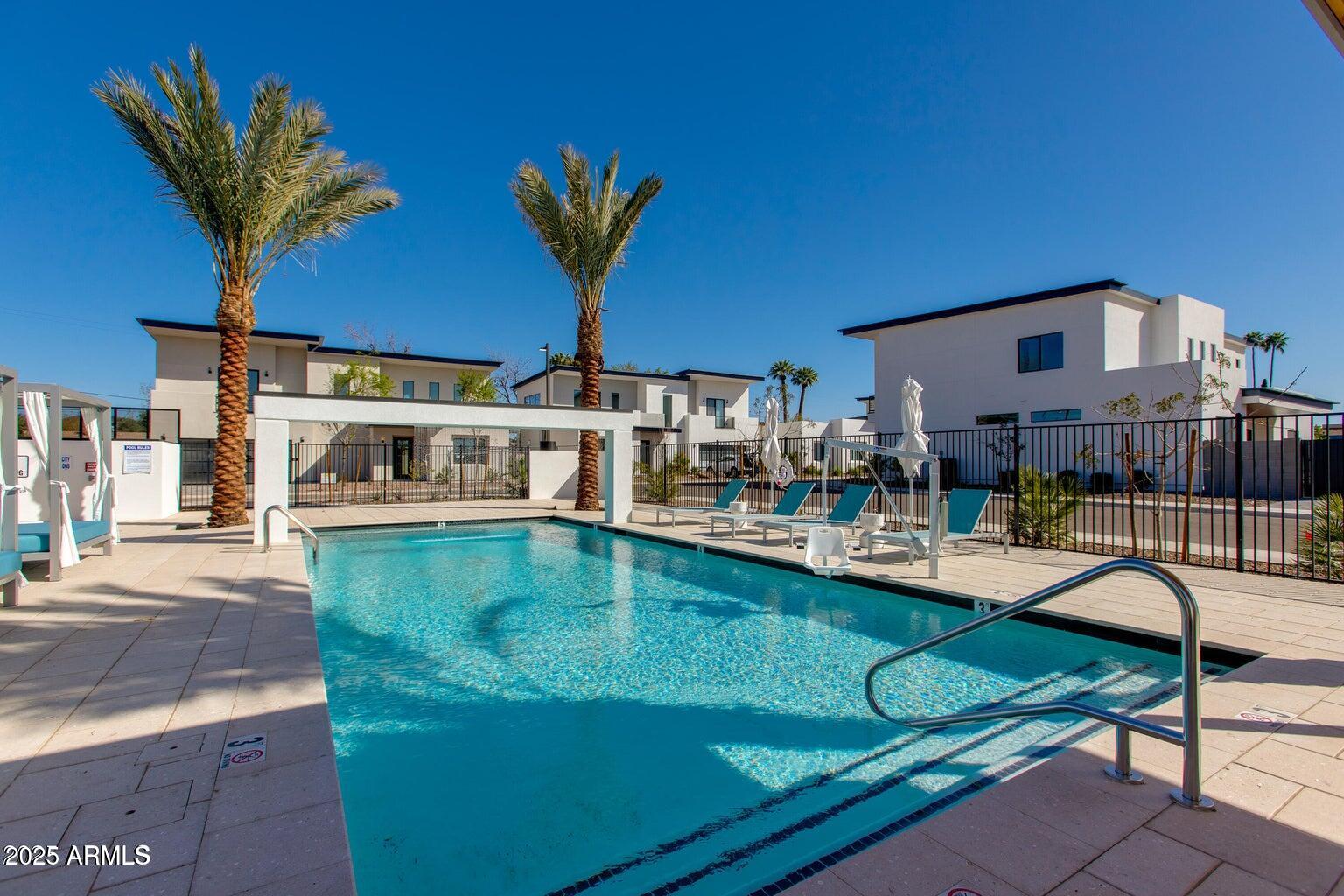 100 West Northern Avenue, Unit 17 Phoenix, AZ 85021 - Photo 17 of 20 a front view of a house with swimming pool yard and outdoor seating