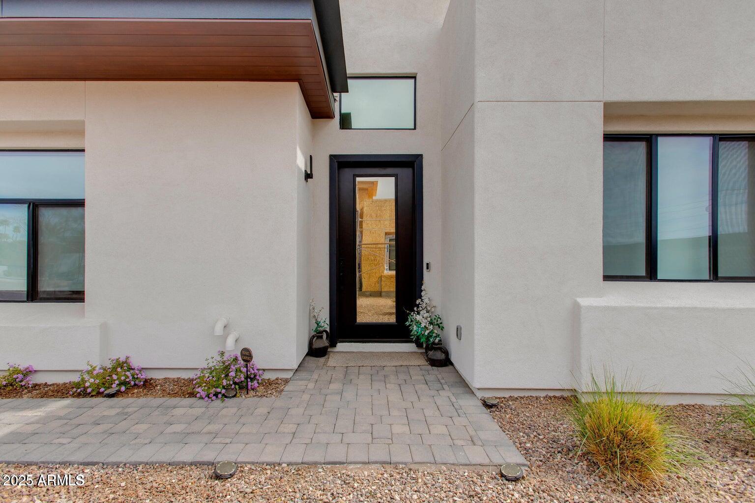 100 West Northern Avenue, Unit 17 Phoenix, AZ 85021 - Photo 4 of 20 a view of a hallway with wooden floor and a living room