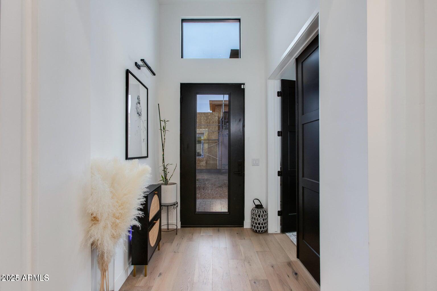 100 West Northern Avenue, Unit 17 Phoenix, AZ 85021 - Photo 5 of 20 a view of a hallway with wooden floor and staircase