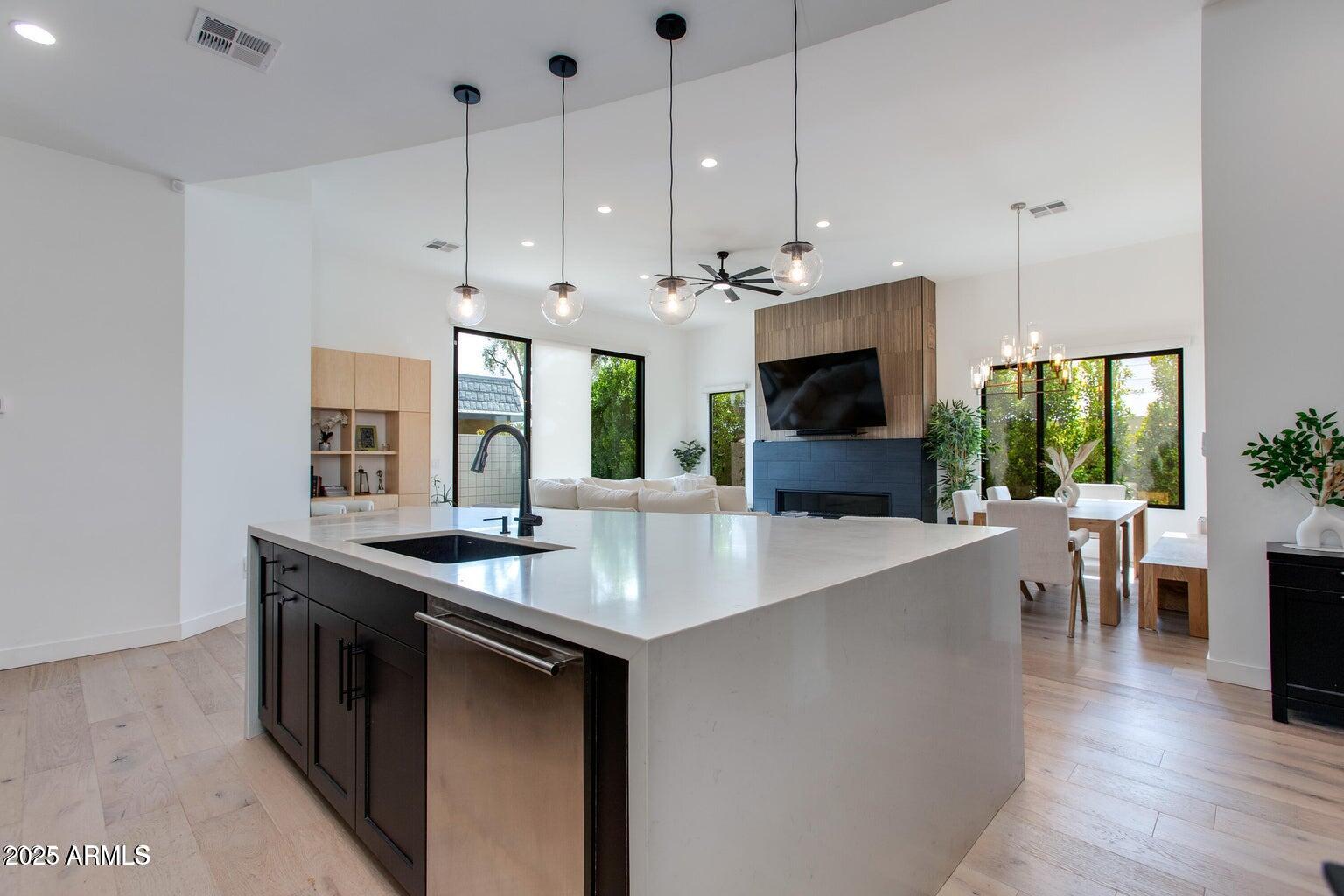 100 West Northern Avenue, Unit 17 Phoenix, AZ 85021 - Photo 10 of 20 a kitchen with stainless steel appliances granite countertop a sink a stove and a wooden floors