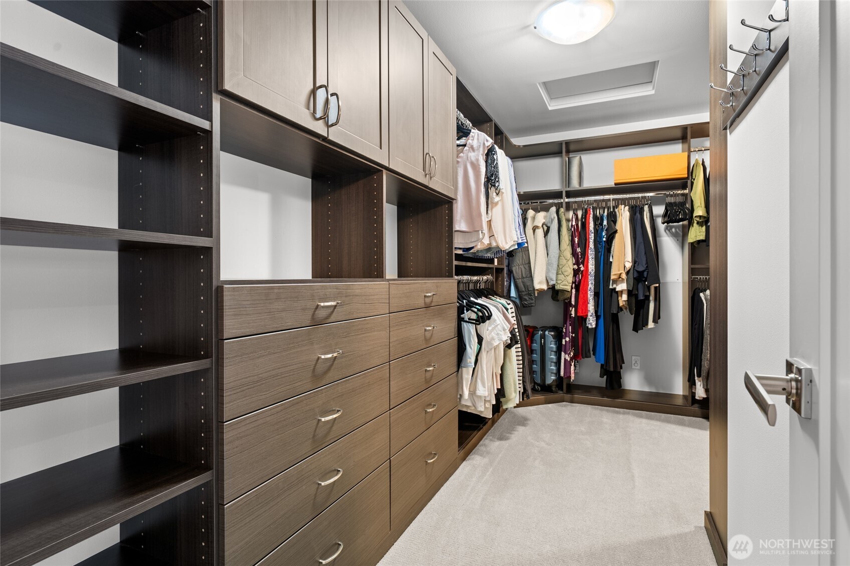 22326 2nd Place Southeast Bothell, WA 98021 - Photo 19 of 40 a view of walk in closet with clothes and shoes