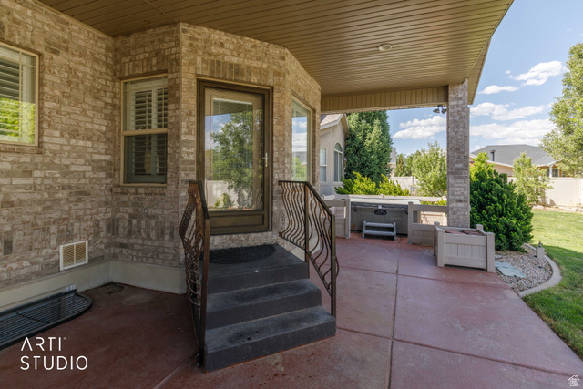 2327 Bluff Ridge Drive Syracuse, UT 84075 - Photo 45 of 66 Covered patio featuring a stained concrete surface and direct access to the interior