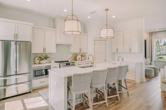 a spacious bedroom with a bed and ceiling fan