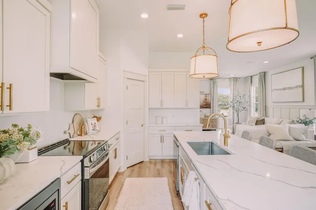 a bath tub sitting in a bathroom next to a white house