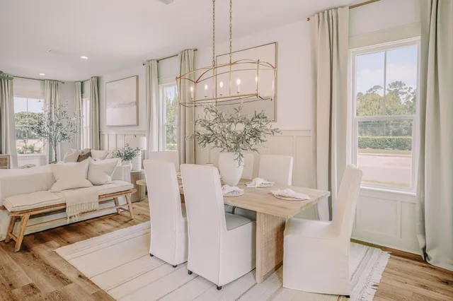 a bedroom with a bed and a potted plant