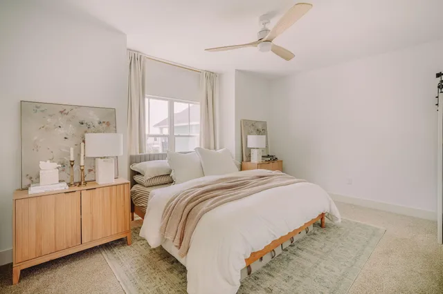 a close view of a sink and a potted plant on a granite counter
