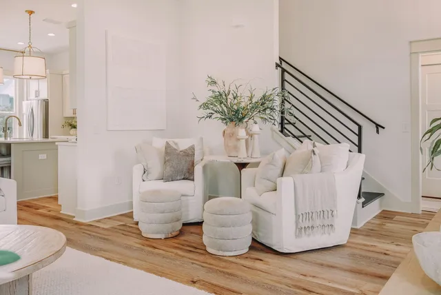 a large white kitchen with a large window