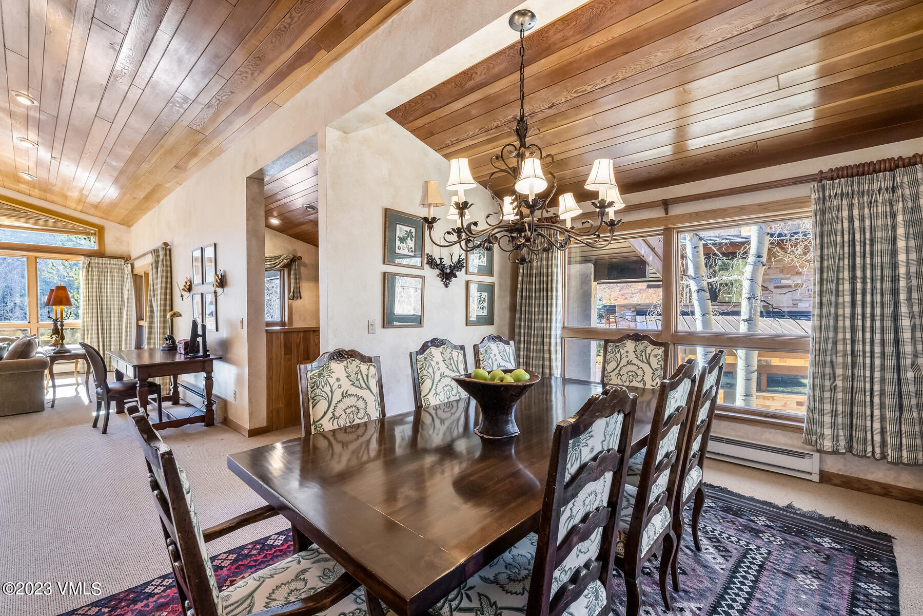 736 Sandy Lane, Unit 1 Vail, CO 81657 - Photo 12 of 36 a dining room with furniture a chandelier and wooden floor