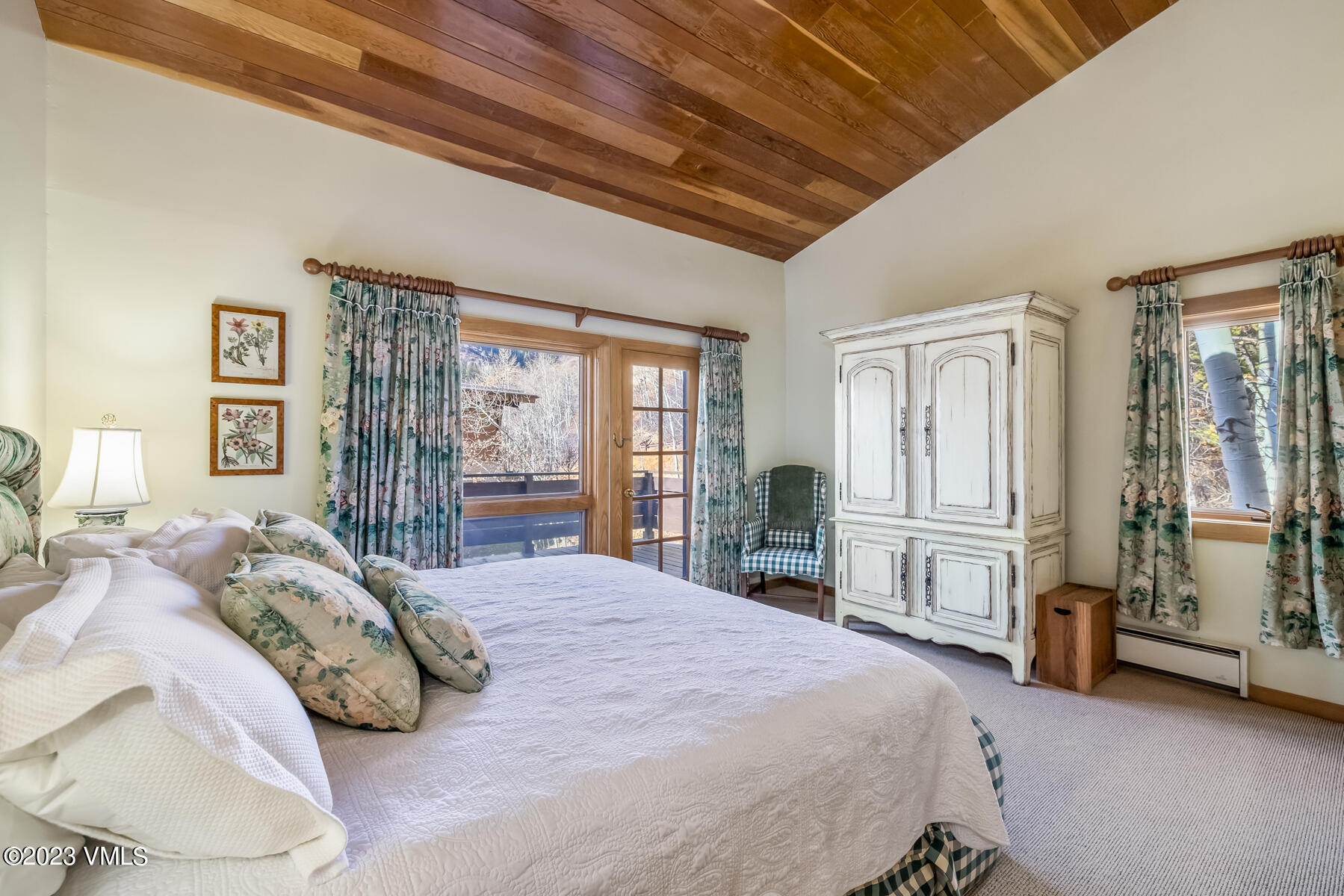 736 Sandy Lane, Unit 1 Vail, CO 81657 - Photo 19 of 36 a bedroom with a large bed and a large window