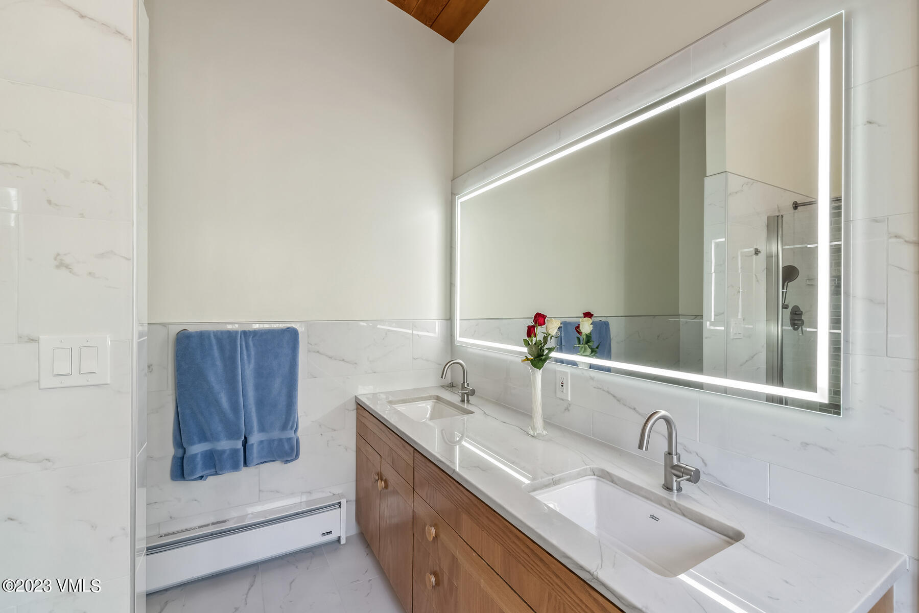736 Sandy Lane, Unit 1 Vail, CO 81657 - Photo 20 of 36 a bathroom with a sink and a mirror