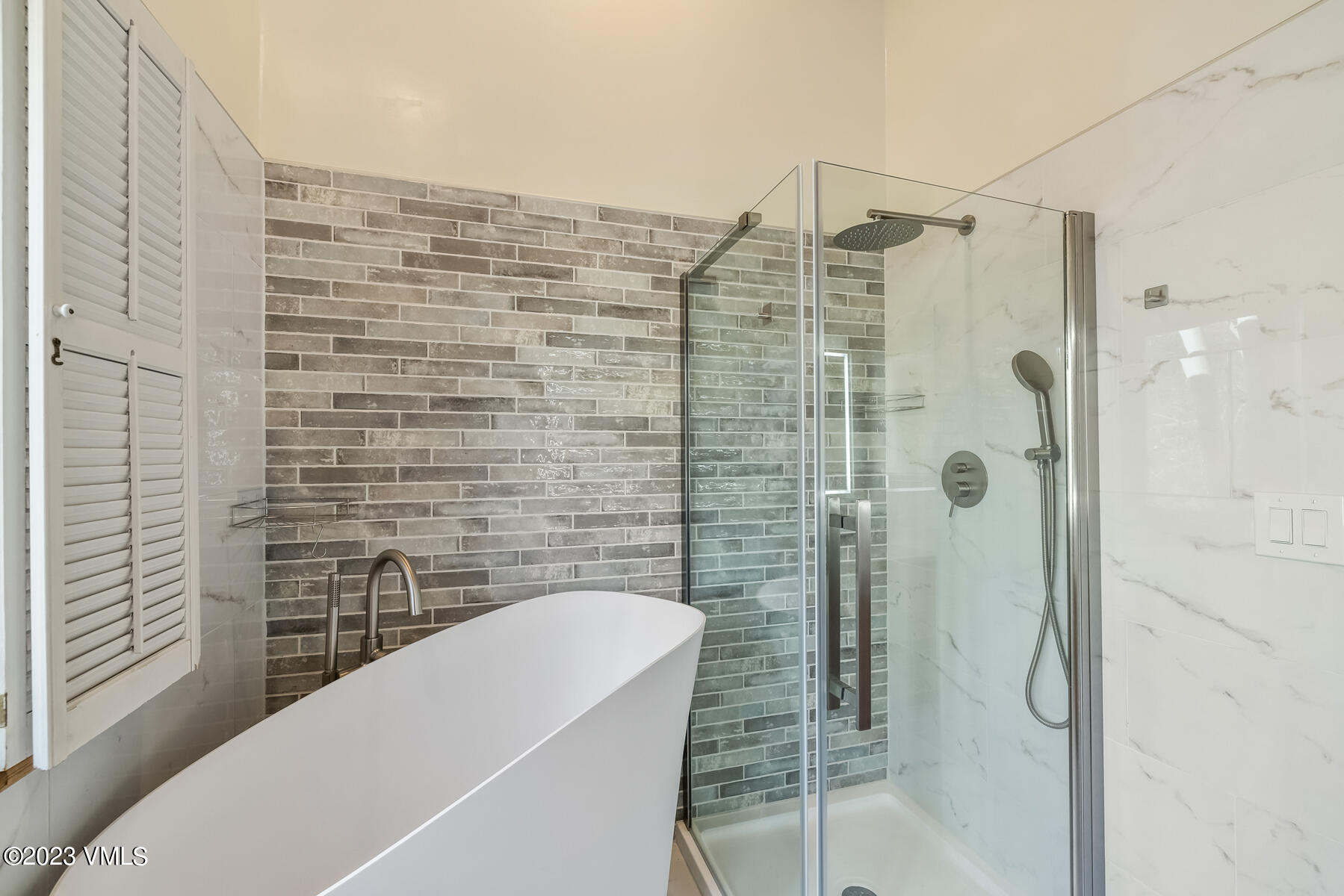 736 Sandy Lane, Unit 1 Vail, CO 81657 - Photo 21 of 36 a bathroom with a shower and a sink