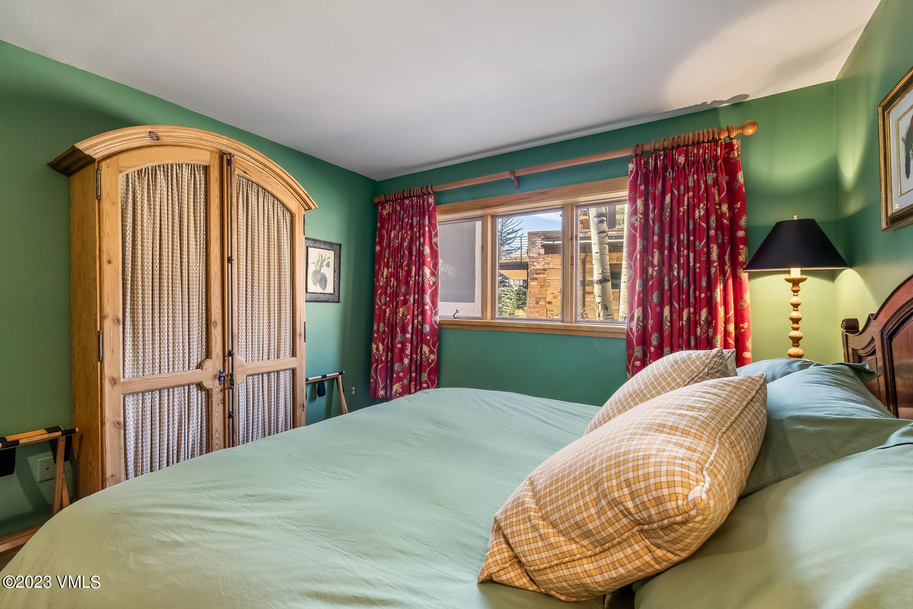 736 Sandy Lane, Unit 1 Vail, CO 81657 - Photo 22 of 36 a bedroom with a bed and a painting on the wall