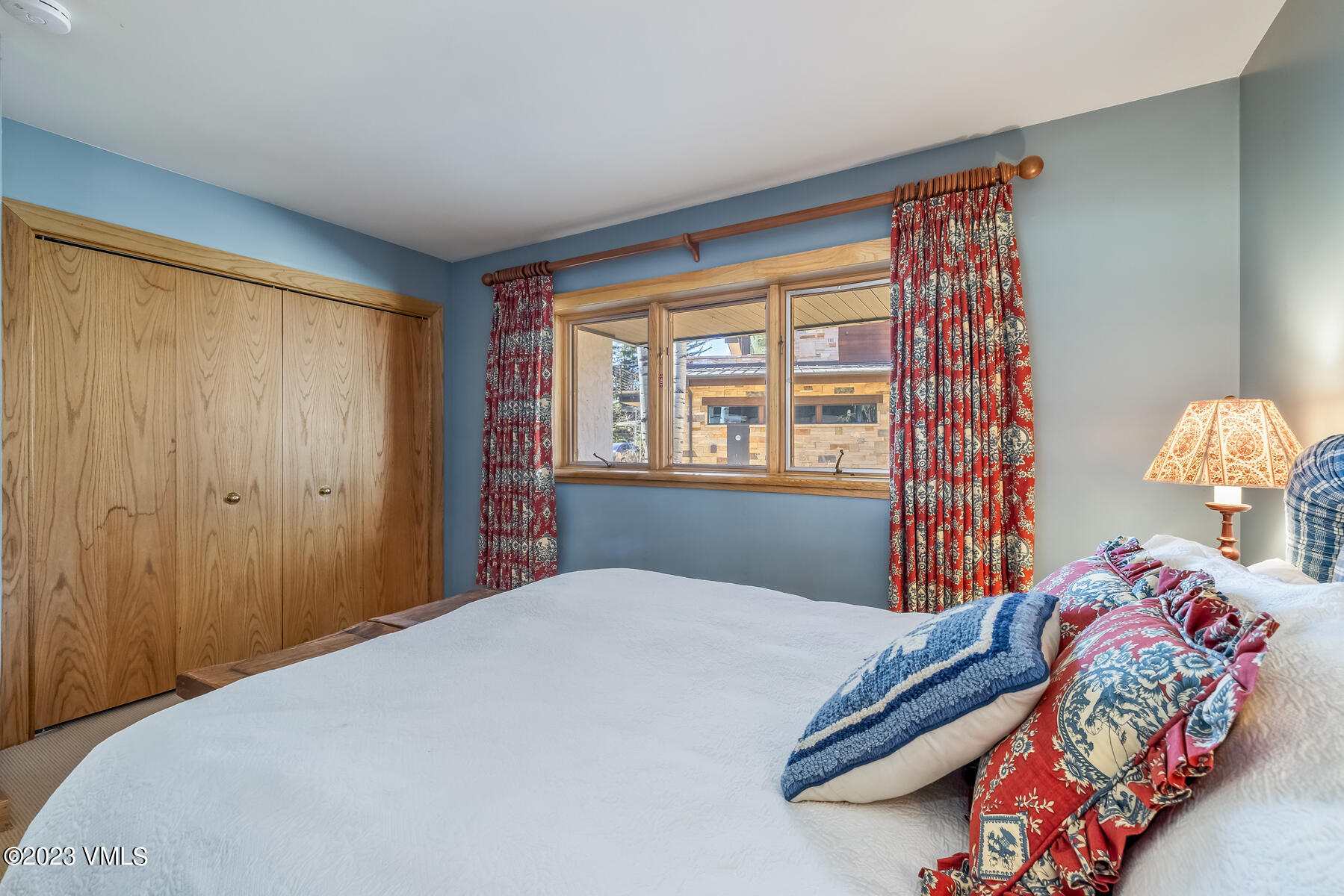 736 Sandy Lane, Unit 1 Vail, CO 81657 - Photo 26 of 36 a bedroom with a bed and a window