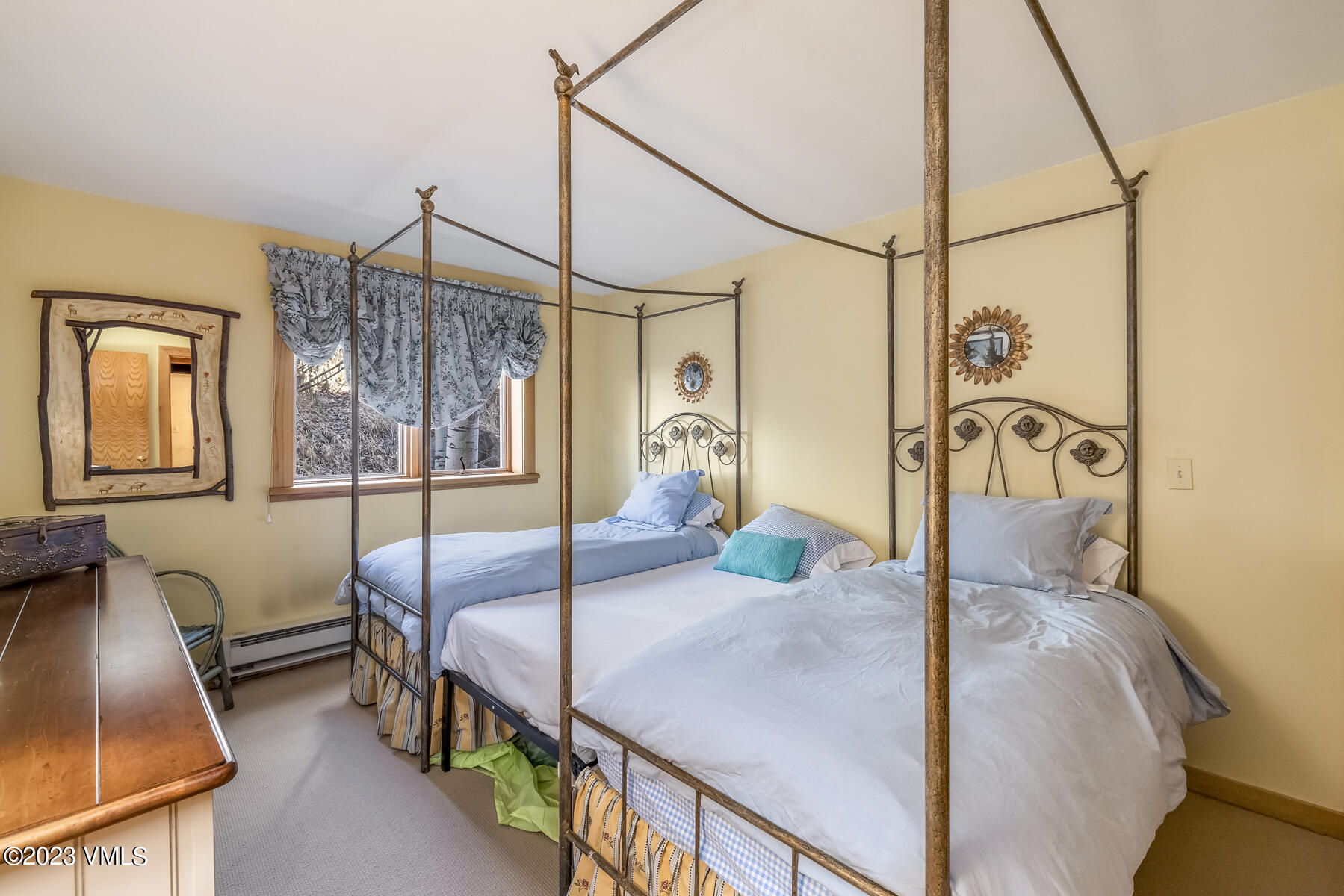 736 Sandy Lane, Unit 1 Vail, CO 81657 - Photo 27 of 36 a bedroom with double bed and a window