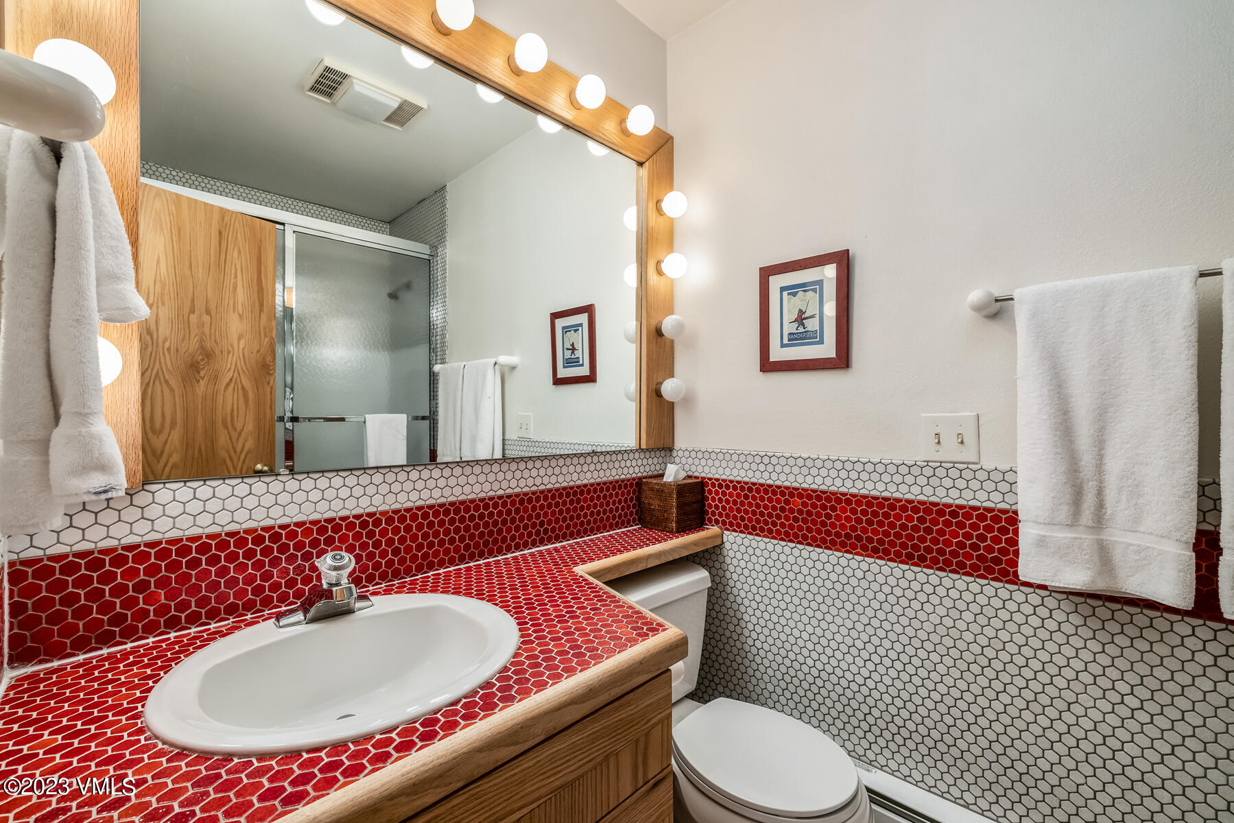 736 Sandy Lane, Unit 1 Vail, CO 81657 - Photo 28 of 36 a bathroom with a sink a toilet and a mirror