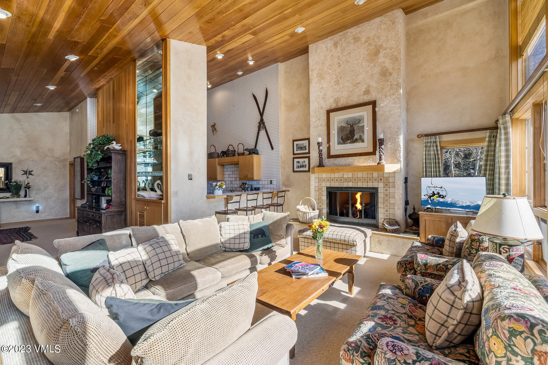 736 Sandy Lane, Unit 1 Vail, CO 81657 - Photo 3 of 36 a living room with furniture large window and a fireplace
