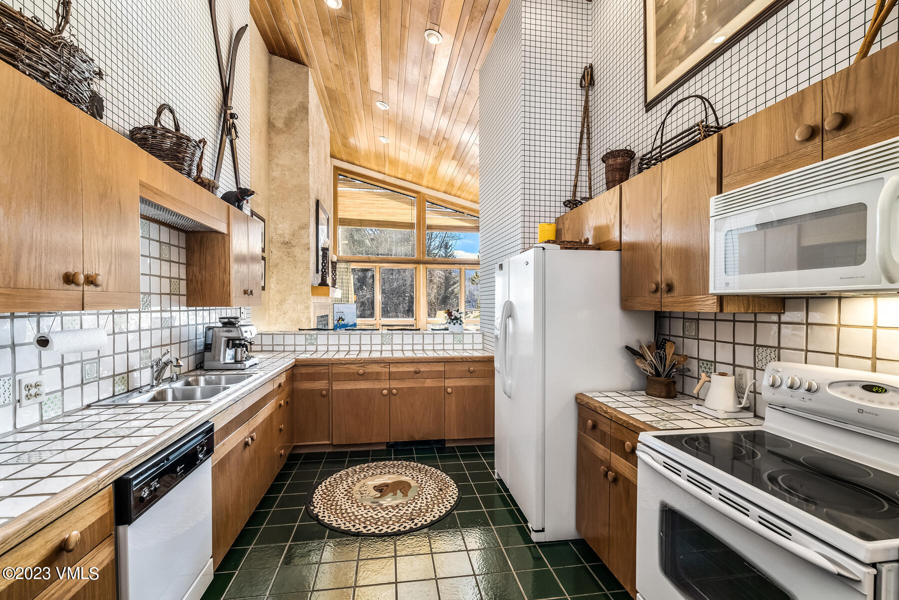 736 Sandy Lane, Unit 1 Vail, CO 81657 - Photo 7 of 36 a kitchen with a stove and a sink