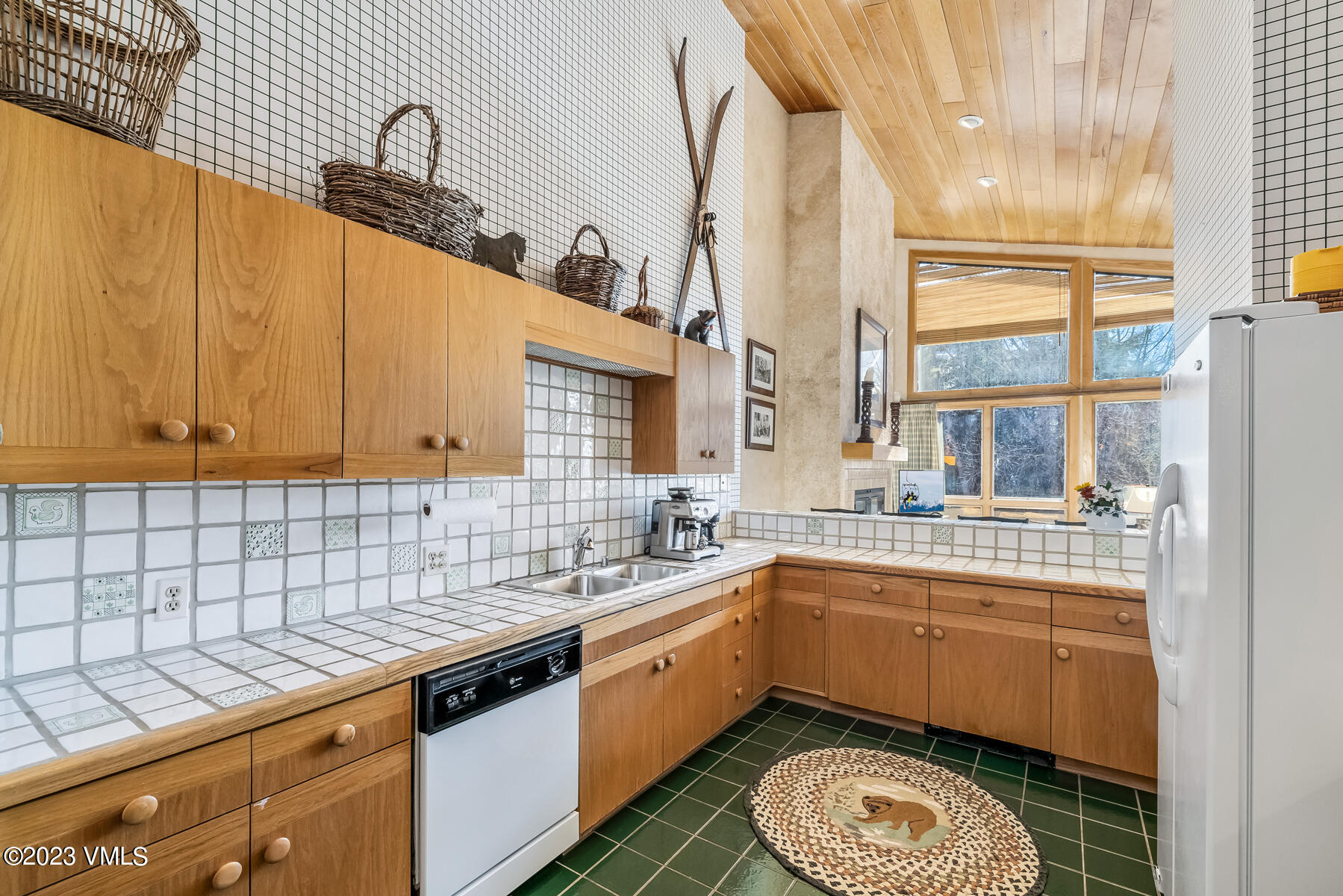 736 Sandy Lane, Unit 1 Vail, CO 81657 - Photo 8 of 36 a kitchen with a sink a stove and cabinets