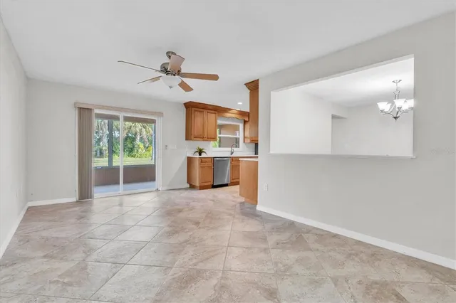a view of a kitchen with a sink and a window