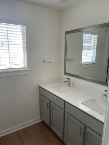 a bathroom with a sink and a window
