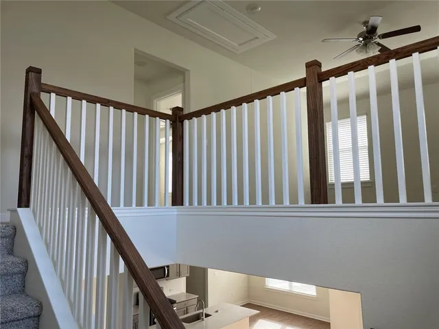 a view of wooden floor and windows in a room
