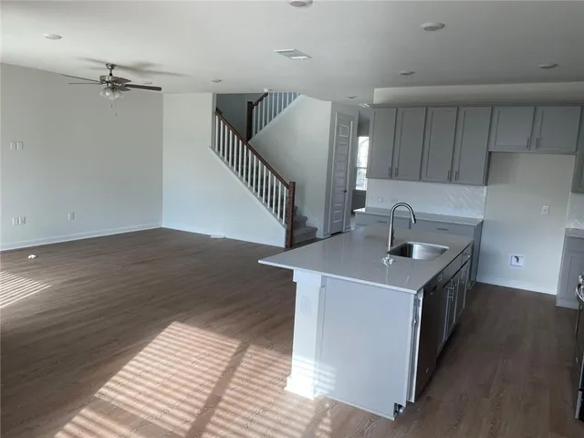 a kitchen with a sink and cabinets