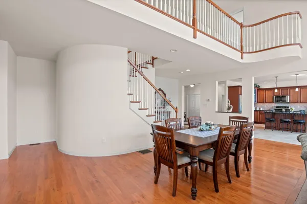 a en suite bathroom with a double vanity sink a toilet and a tub