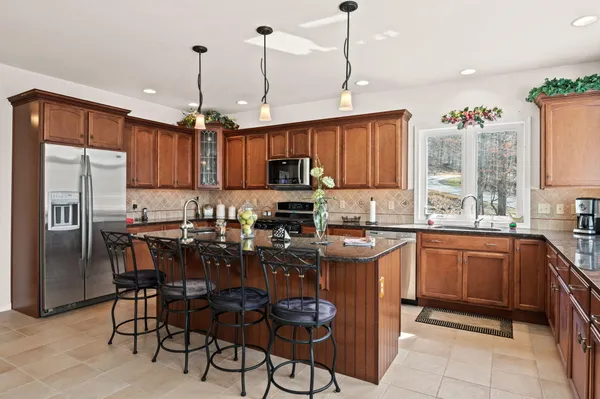 a kitchen with a sink and a stove