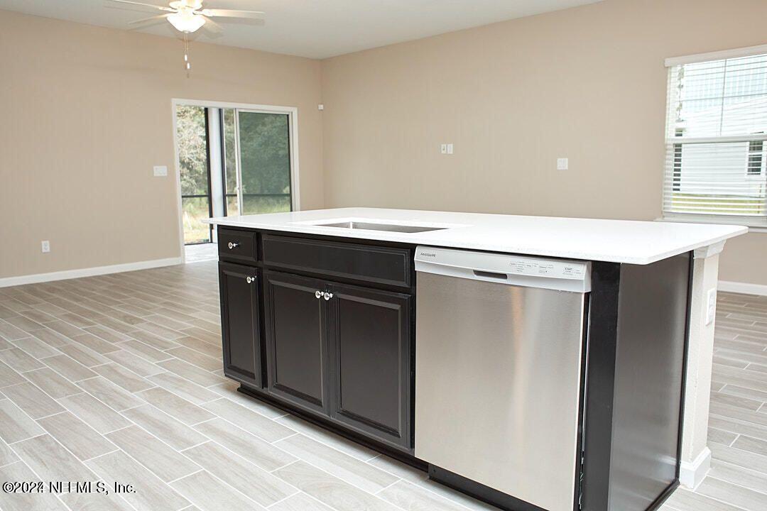 340 Boracay Circle St. Johns, FL 32259 - Photo 15 of 31 an empty room with windows and cabinet
