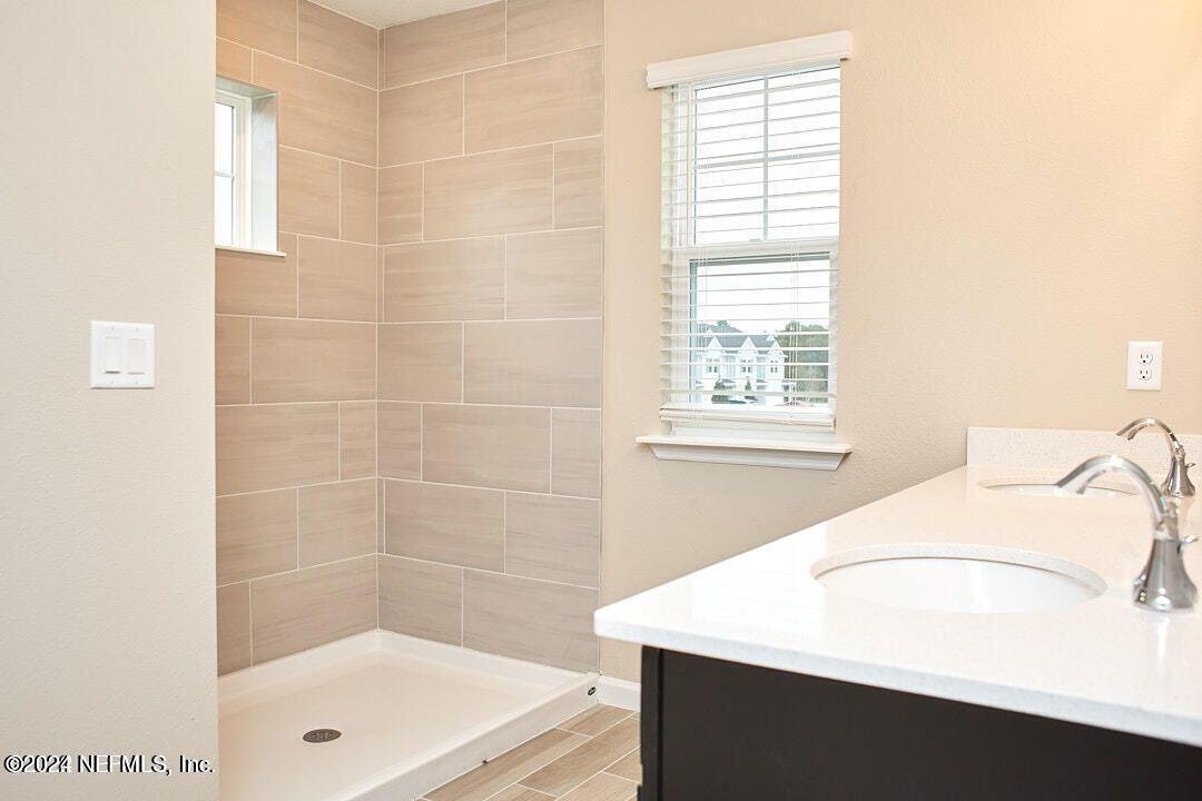 340 Boracay Circle St. Johns, FL 32259 - Photo 21 of 31 a bathroom with a bathtub and a window