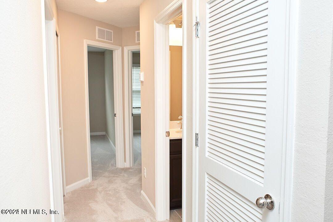 340 Boracay Circle St. Johns, FL 32259 - Photo 24 of 31 a view of a bathroom from a corridor