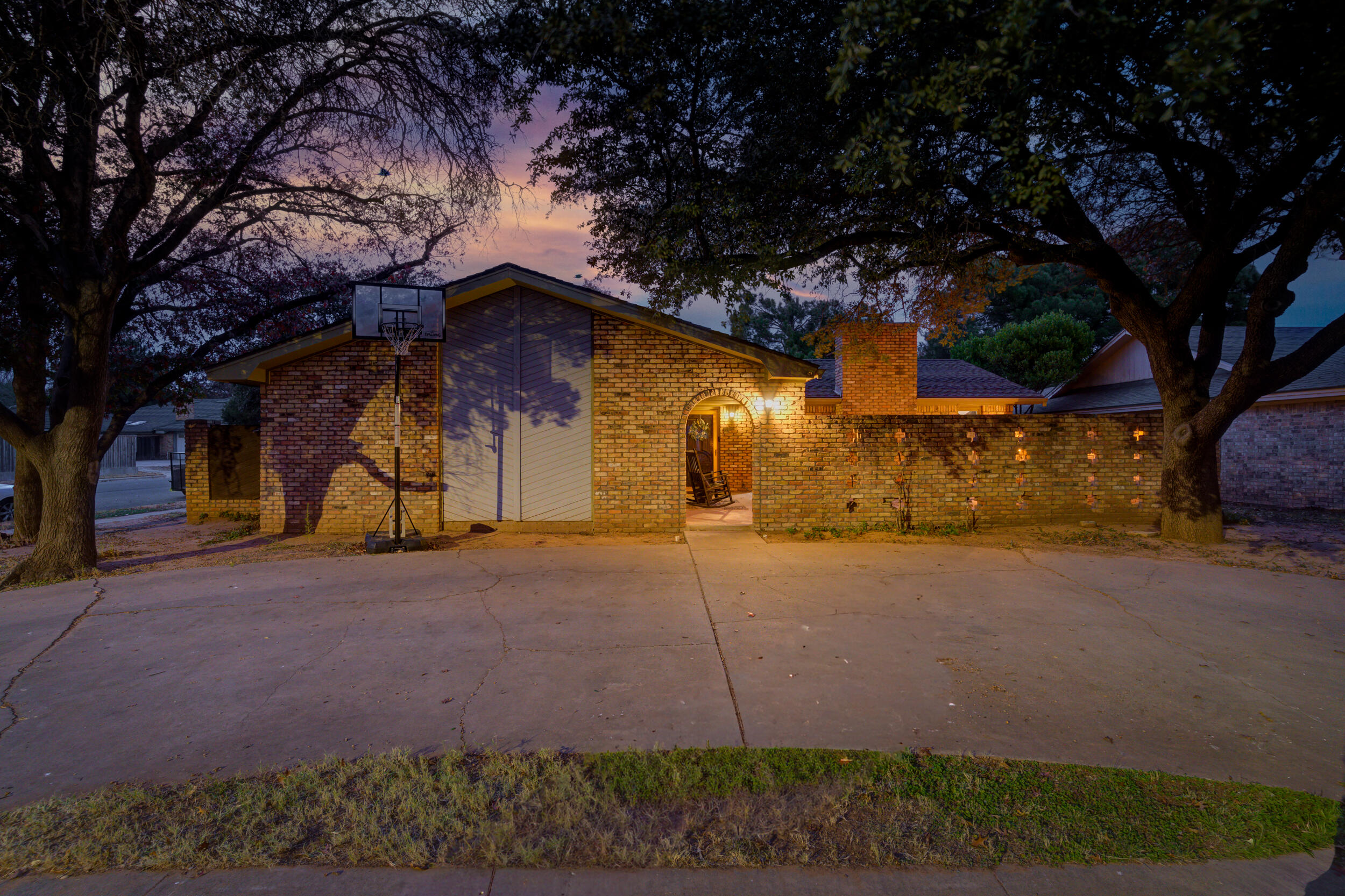4524 79th Street Lubbock, TX 79424 - Photo 1 of 45 a yellow house with tree in front of it