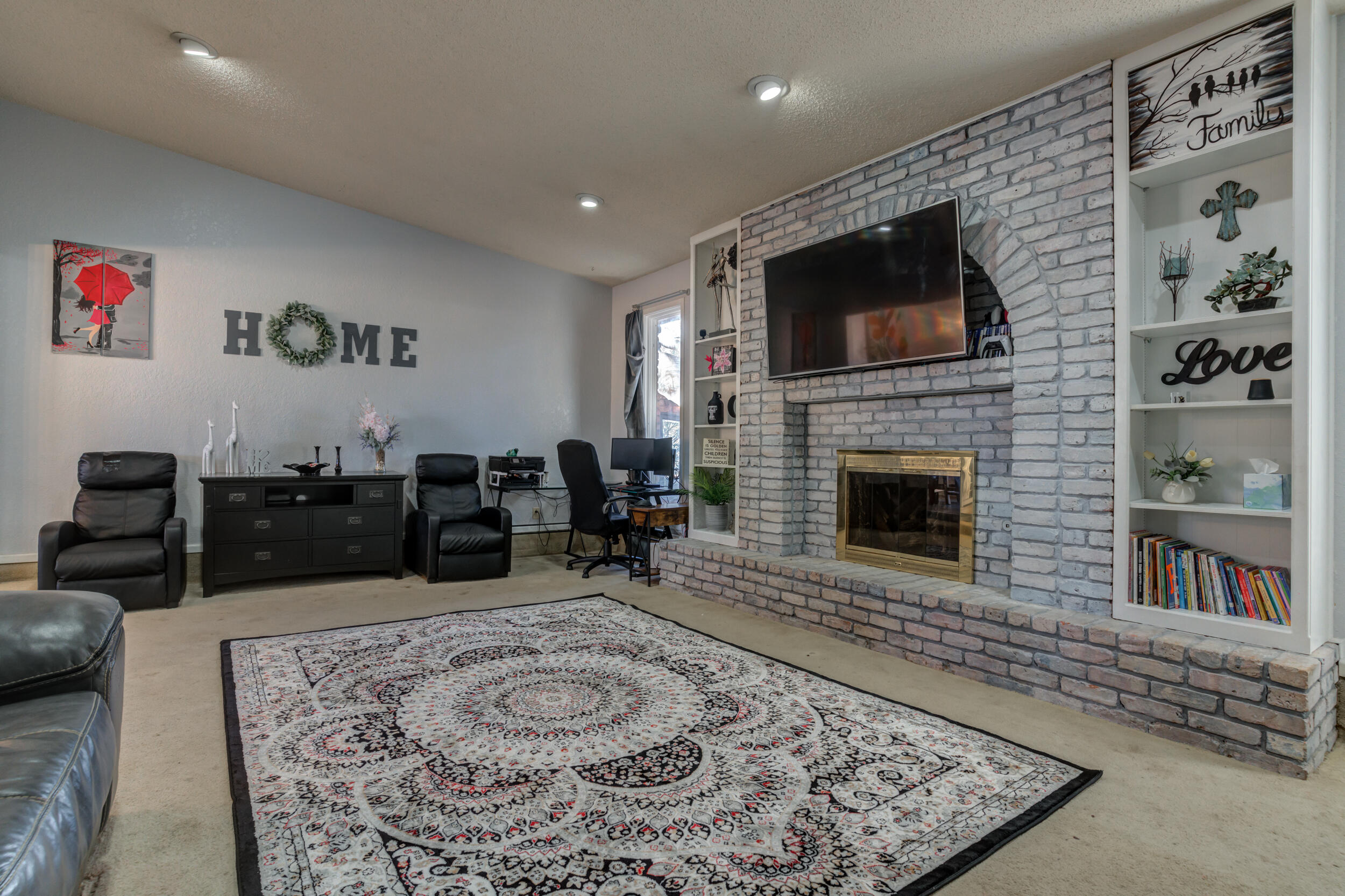 4524 79th Street Lubbock, TX 79424 - Photo 11 of 45 a living room with fireplace furniture and a rug