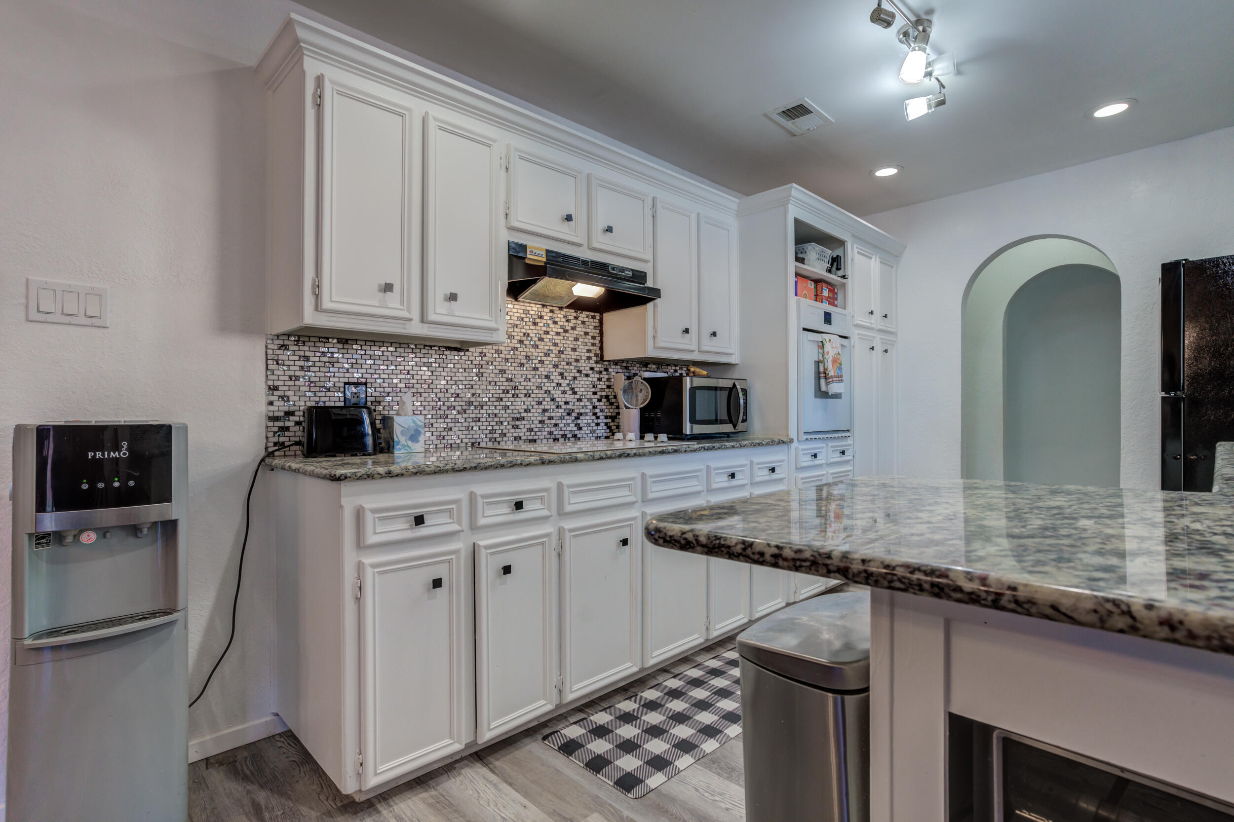 4524 79th Street Lubbock, TX 79424 - Photo 17 of 45 a kitchen with stainless steel appliances granite countertop a sink a stove and a refrigerator