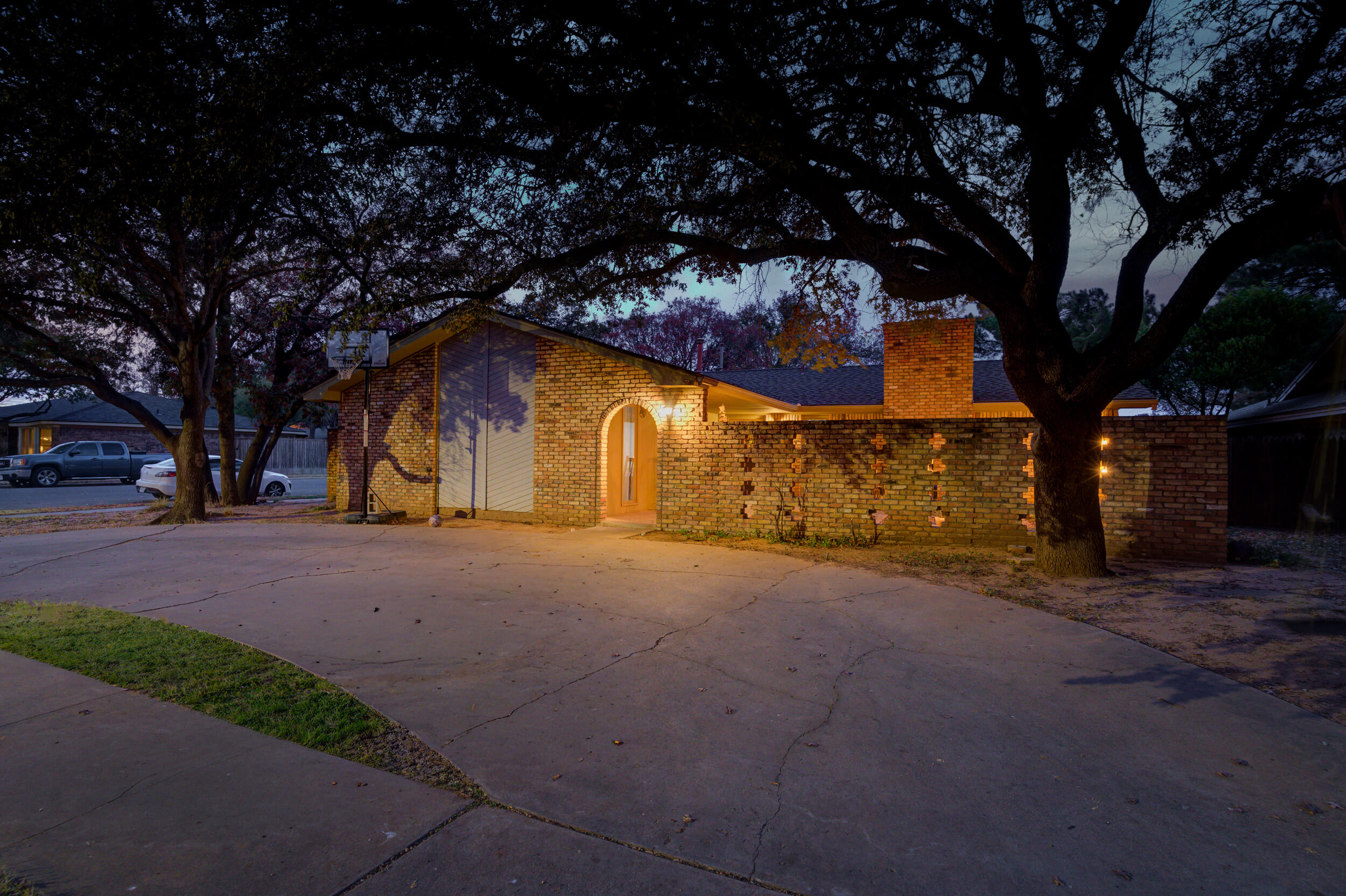 4524 79th Street Lubbock, TX 79424 - Photo 2 of 45 a house with trees in front of it