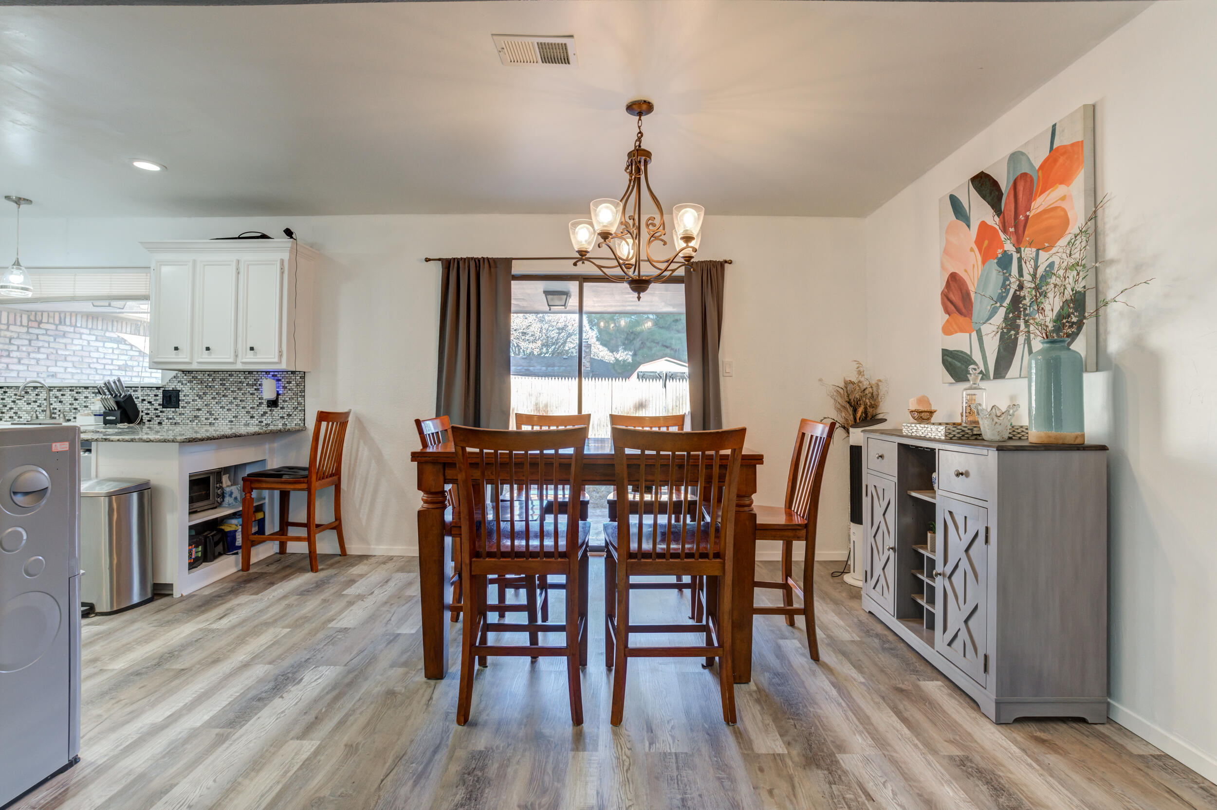 4524 79th Street Lubbock, TX 79424 - Photo 28 of 45 a view of a dining room with furniture window and wooden floor