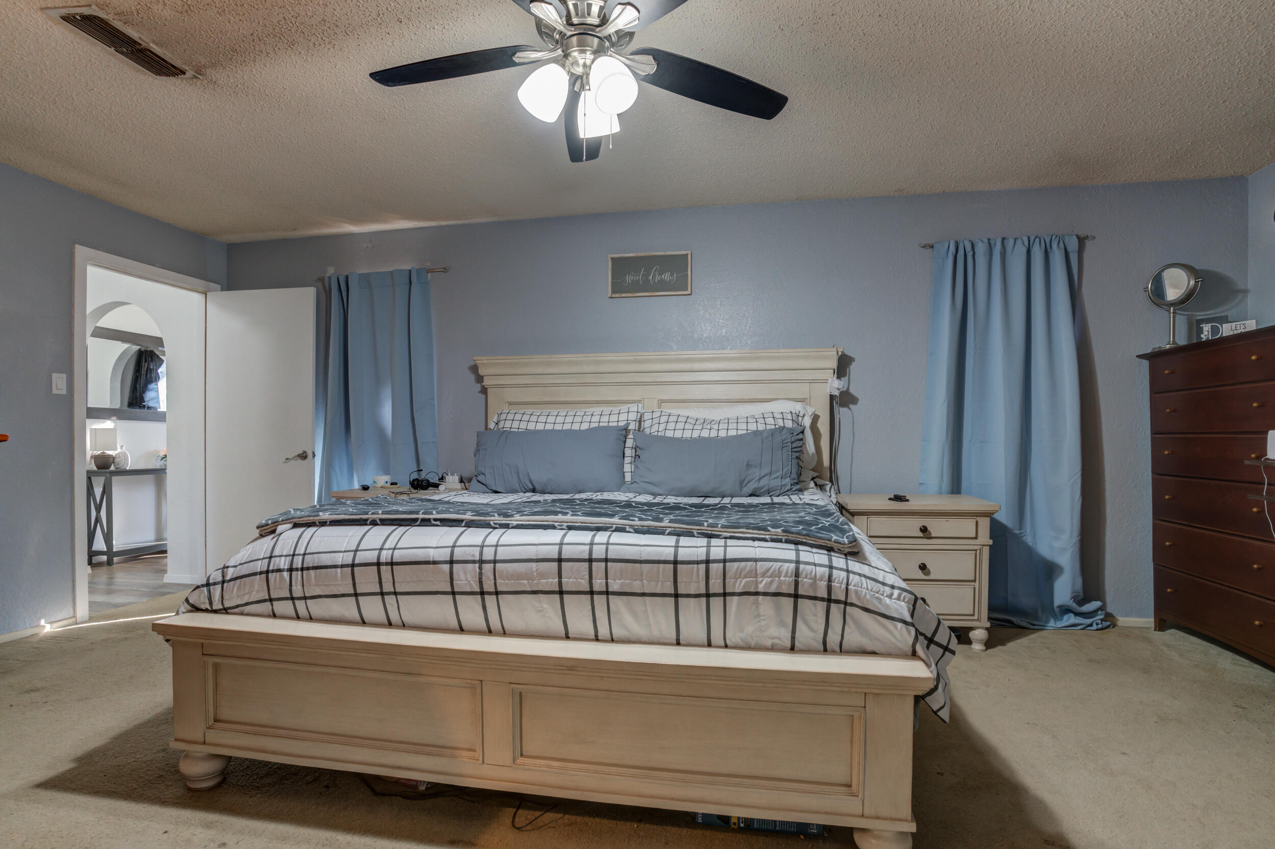 4524 79th Street Lubbock, TX 79424 - Photo 30 of 45 a bedroom with a bed and wooden floor