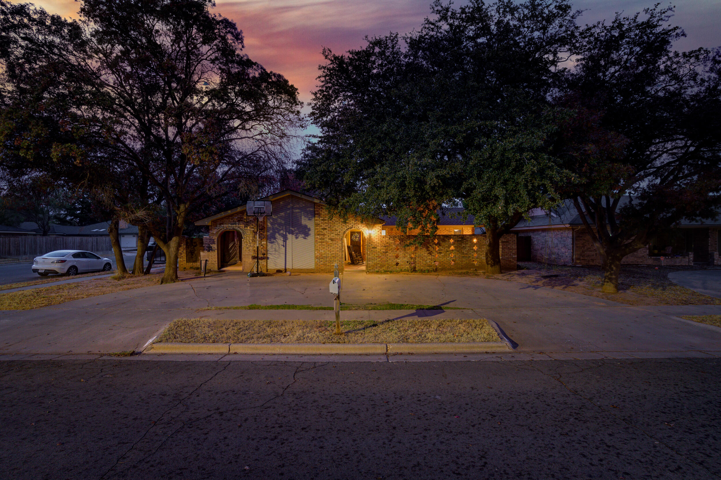 4524 79th Street Lubbock, TX 79424 - Photo 3 of 45 a front view of a house with a yard
