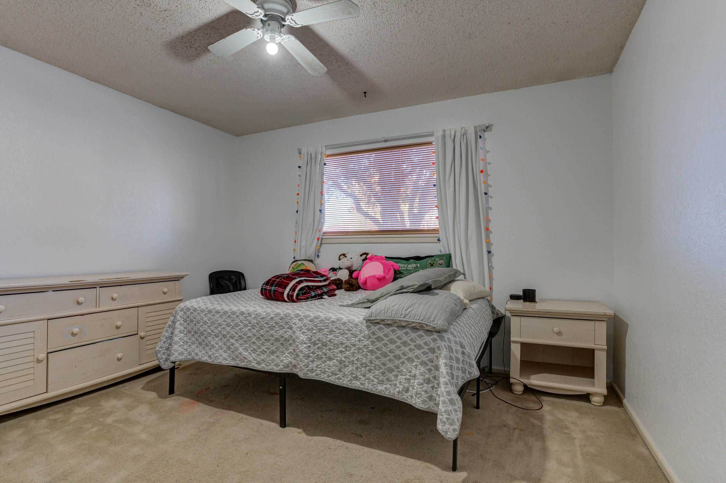 4524 79th Street Lubbock, TX 79424 - Photo 36 of 45 a bedroom with furniture and a bed