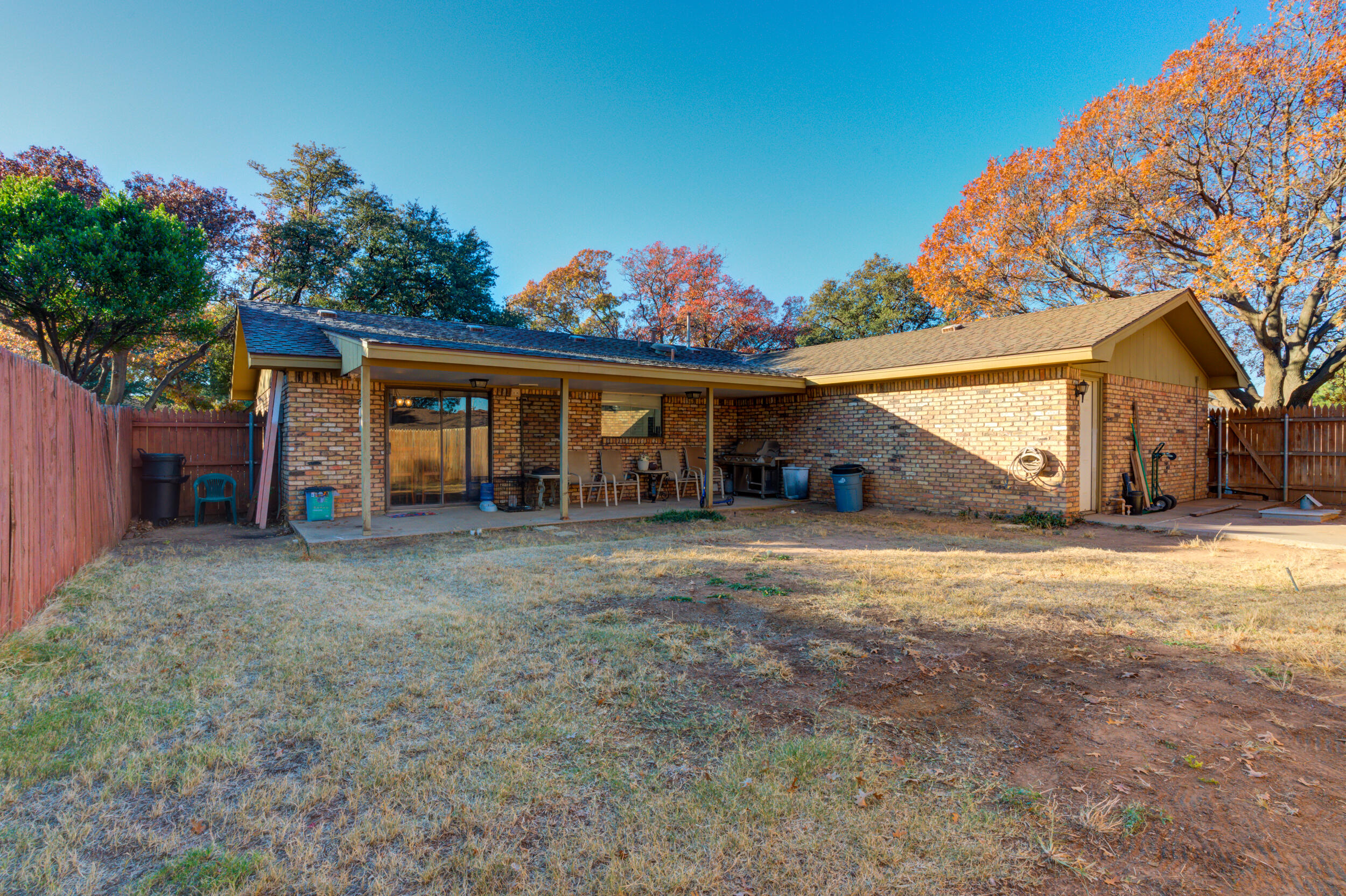 4524 79th Street Lubbock, TX 79424 - Photo 43 of 45 a view of a house with a yard and garage