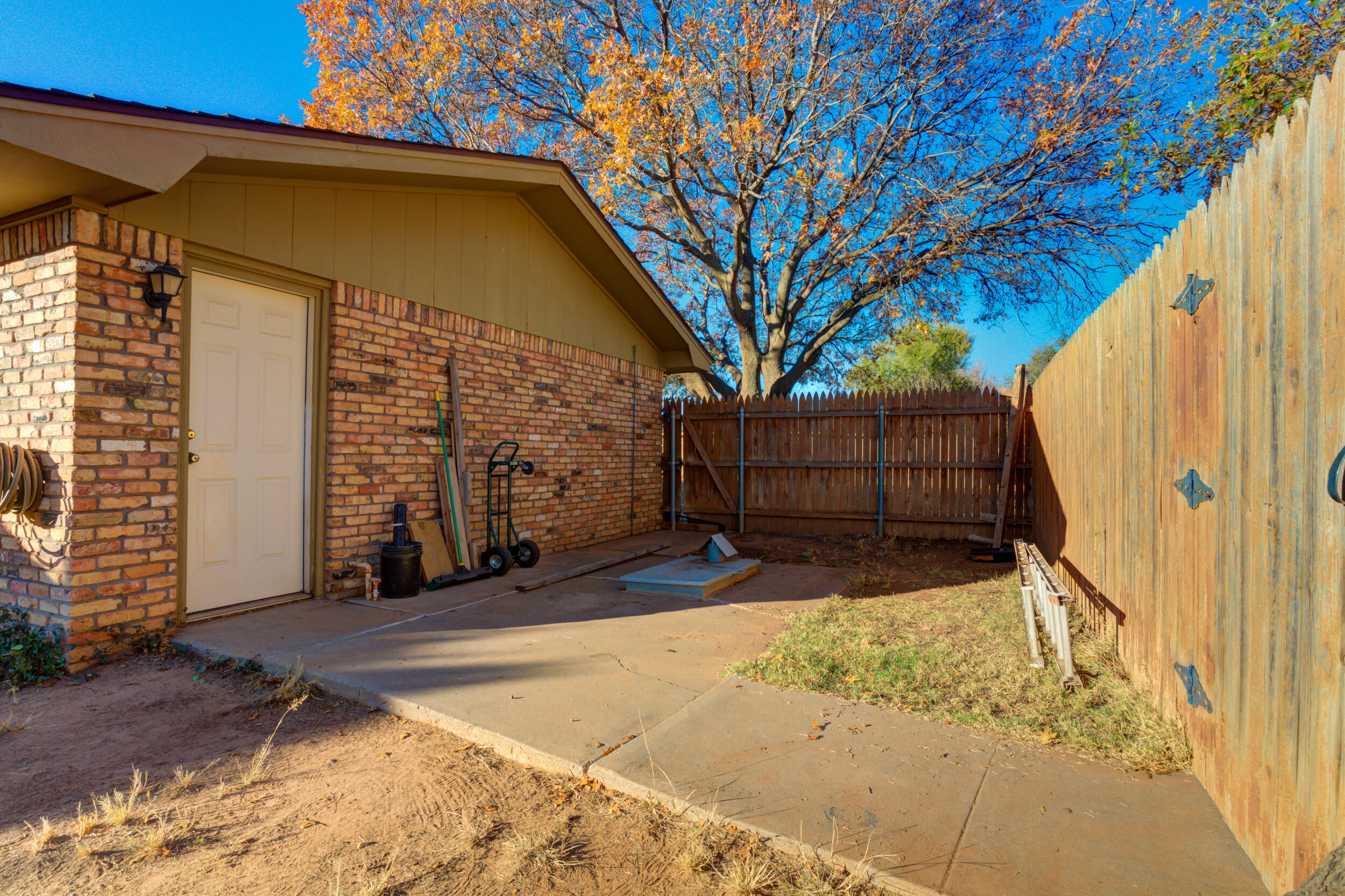 4524 79th Street Lubbock, TX 79424 - Photo 44 of 45 a view of backyard with a large tree